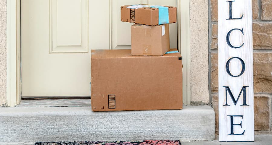 Boxes by the door of a residence with a welcome sign in Stamford